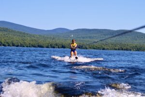 A traditional summer camp may include activities like waterski